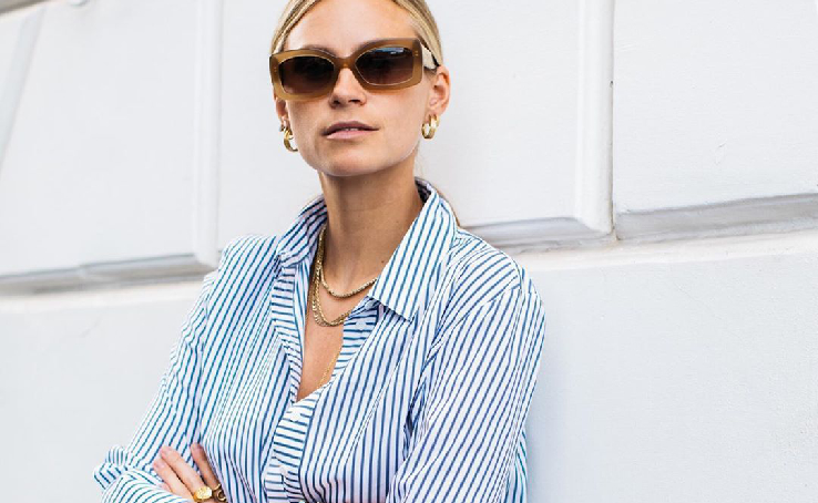 A laconic oxford shirt is considered one of the trends this spring.